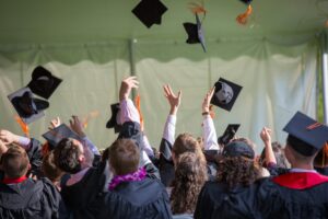 Best Ecology Universities in the US 1 Group of graduates celebrating by tossing caps into the air during a graduation ceremony.