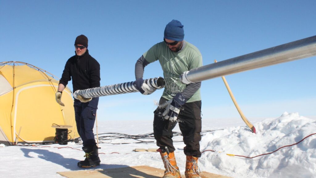 scientists drilling a shallow ice core