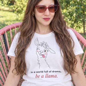 Ecologist Eli Frey wearing the white organic cotton funny llama t shirt with the slogan In a world full of drama, be a llama