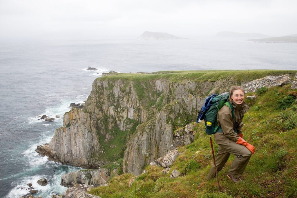 wildlife biologist conducting field research on a coastal wildlife refuge